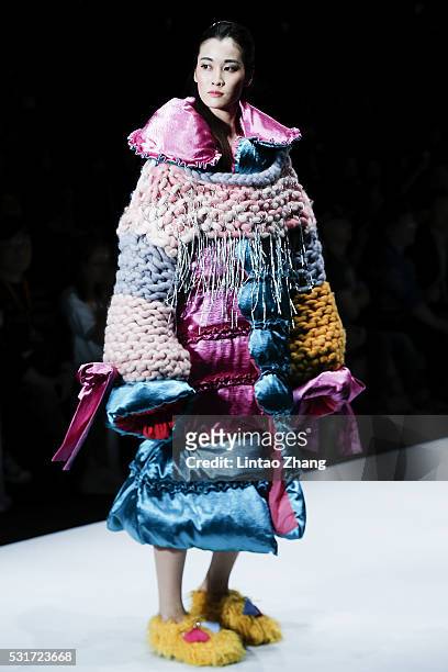 Model showcases designs on the runway at Wuhan Textile University Graduate Show during the day two of China Graduate Fashion Week at the 751 D.Park...