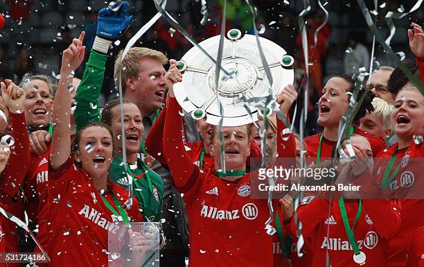 Team captain Melanie Behringer and her teammates of Bayern Muenchen celebrate the German Championship victory after the women Bundesliga match...