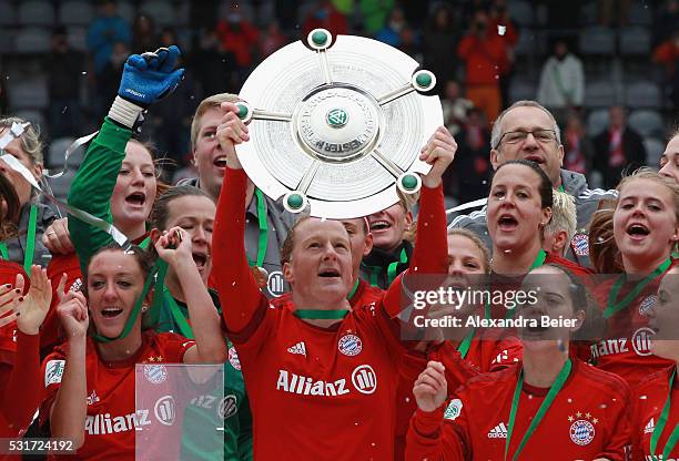 Team captain Melanie Behringer and her teammates of Bayern Muenchen celebrate the German Championship victory after the women Bundesliga match...
