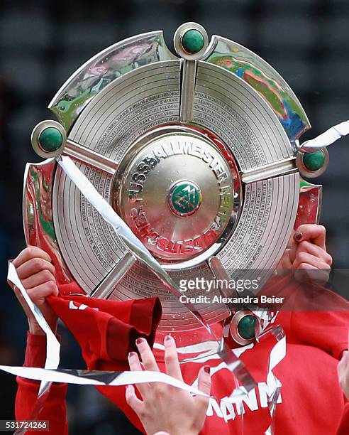 The Bayern Muenchen women team celebrates their German Championship victory holding up the trophy after the women Bundesliga match between FC Bayern...