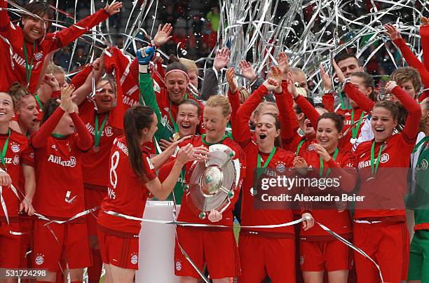 Team captain Melanie Behringer and her teammates of Bayern Muenchen celebrate the German Championship victory after the women Bundesliga match...