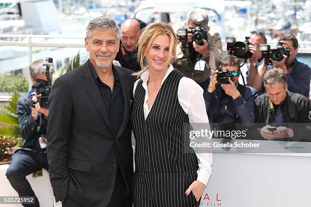 Actors George Clooney and Julia Roberts attend the "Money Monster" photocall during the 69th annual Cannes Film Festival at the Palais des Festivals...