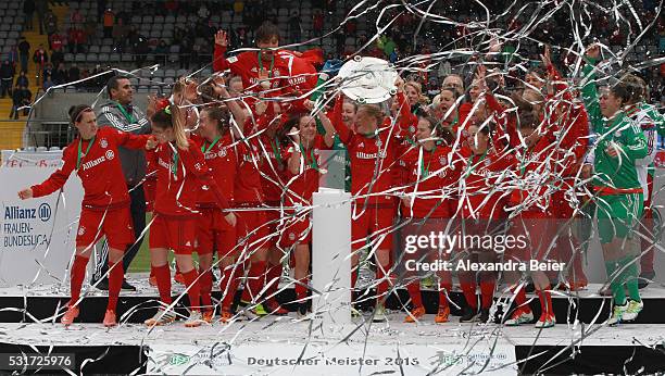 Team captain Melanie Behringer and her teammates of Bayern Muenchen celebrate the German Championship title after the women Bundesliga match between...