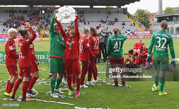 The players of Bayern Muenchen celebrate their German Championship title holding up the trophy after the women Bundesliga match between FC Bayern...