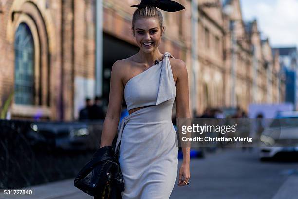Elyse Knowles wearing a creme off shoulder dress from Misha Collection outside Misha Collection at Mercedes-Benz Fashion Week Resort 17 Collections...