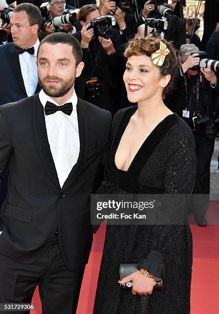 Guillaume Gouix and Alysson Paradis attend the 'From The Land Of The Moon ' premiere during the 69th annual Cannes Film Festival at the Palais des...