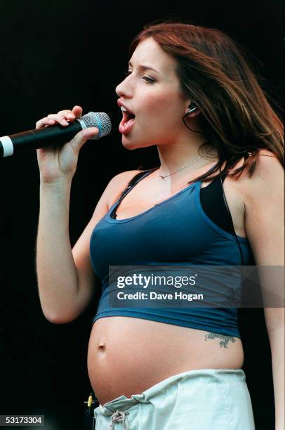 Pregnant Melanie Blatt of the group All Saints performing on stage at Capital Fm's Party in the Park in London's Hyde Park during July 1998.