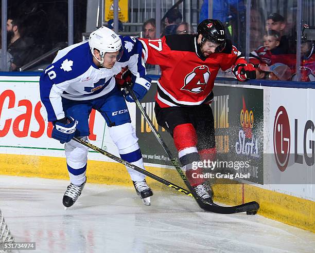 Stuart Percy of the Toronto Marlies battles for the puck with Marc-Andre Gragnani of the Albany Devils during AHL playoff game action on May 14, 2016...