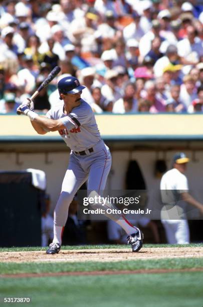 Dwight Evans of the Boston Red Sox bats against the Oakland Athletics during a game in the 1990 season at Oakland Alameda Coliseum in Oakland,...