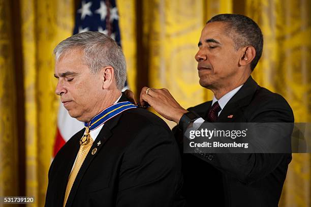 President Barack Obama, right, awards the Medal of Valor to Officer Mario Gutierrez, with the Miami-Dade Police Department, FL, for bravery and...