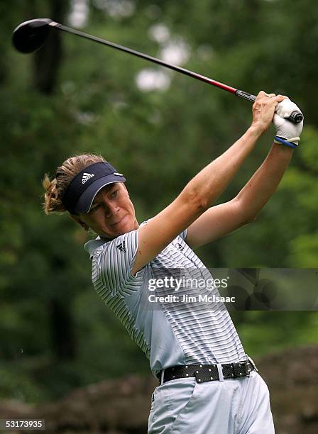 Catriona Matthew of Scotland watches her tee shot on the second hole during her match against A.J. Eathorne of Canada during the first round of the...