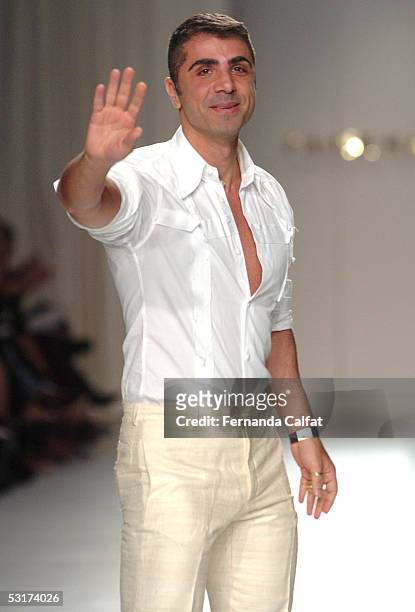 Designer Fause Haten closes the runway the Fause Haten Men Summer 2006 fashion presentation during Sao Paulo Fashion Week June 30, 2005 in Sao Paulo,...