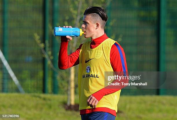 Jack Grealish drinks during an England Under 21 training session at St Georges Park on May 16, 2016 in Burton-upon-Trent, England.