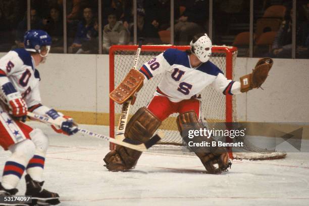 American hockey player Jim Craig, goalkeeper for Team USA, makes a save in an exhibition game against the Soviet team at Madison Square Garden, New...
