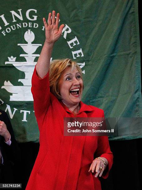 Democratic presidential candidate Hillary Clinton waves to the crowd as she arrives to a campaign rally at La Gala May 16 in Bowling Green, Kentucky....