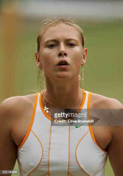 Maria Sharapova of Russia looks on against Venus Williams of USA during the tenth day of the Wimbledon Lawn Tennis Championship on June 30, 2005 at...