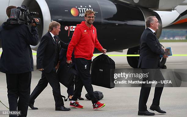 Jurgen Klopp, manager of Liverpool FC, Ian Ayre, Liverpool FC CEO and Kenny Dalglish arrive at Basel airport ahead of the UEFA Europa League Final on...