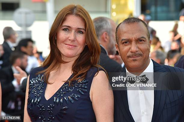 French actor Pascal Legitimus and his wife Adriana Santini pose as they arrive on May 16, 2016 for the screening of the film "Loving" at the 69th...