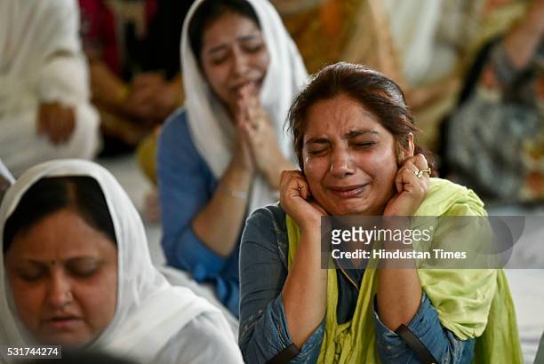 Grieving Devotees pay their last respects to mortal remains of Baba Hardev Singh, spiritual leader of the Sant Nirankari Mission, and his son-in-law...