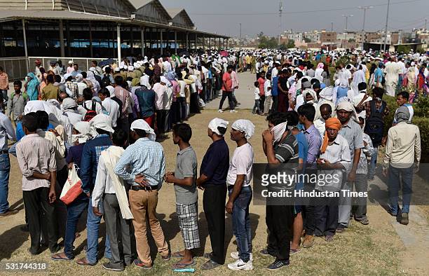 Devotees stand in line to pay their last respects to mortal remains of Baba Hardev Singh, spiritual leader of the Sant Nirankari Mission, and his...
