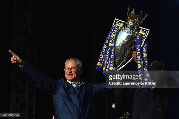 Claudio Ranieri Manager of Leicester City and captain Wes Morgan of Leicester City show the trophy to the fans during the Leicester City Barclays...