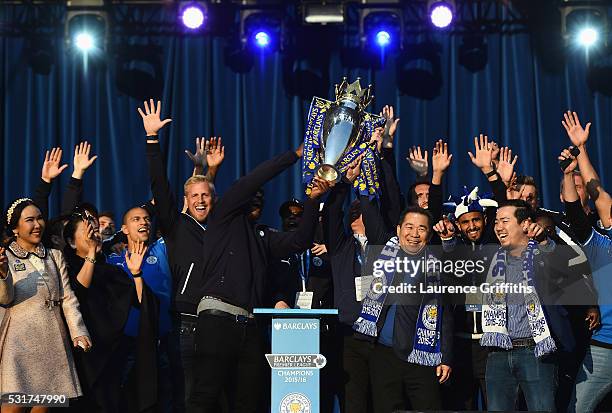 Wes Morgan, Claudio Ranieri Manager of Leicester City and Vichai Srivaddhanaprabha the club owner show the trophy to the fans during the Leicester...