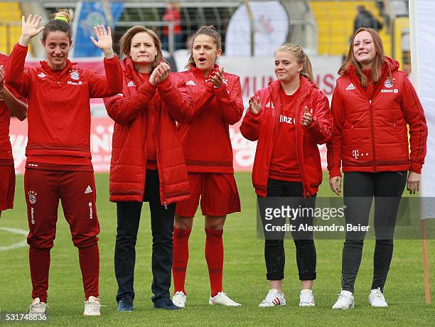 Raffaella Manieri, Fabienne Weber, Laura Feiersinger, Ricarda Walkling and Jenny Gaugigl of Bayern Muenchen wave to fans as they say goodbye before...