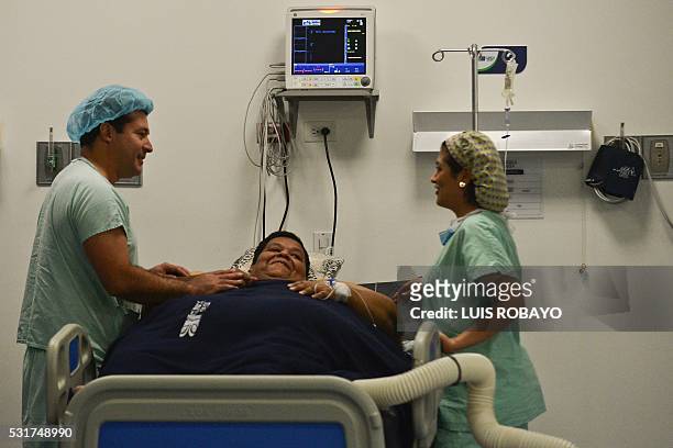 Oscar Vasquez Morales considered the most obese male of country with about 400 kg, gestures next to bariatric surgeon Juan del Castillo on May 16,...