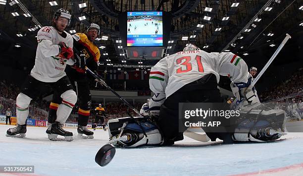 Hungary's goalie Miklos Rajna lets the puck into his net during the group B preliminary round game Germany vs Hungary at the 2016 IIHF Ice Hockey...