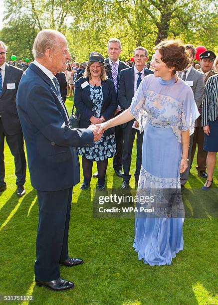 Prince Philip, Duke of Edinburgh meets Anna Friel during the Duke of Edinburgh Award's 60th Anniversary Garden Party at Buckingham Palace on May 16,...