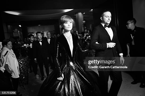 Li Yuchun departs the Martinez Hotel during the 69th annual Cannes Film Festival on May 14, 2016 in Cannes, France.