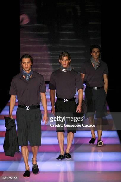 Models walk down the runway at Giorgio Armani show as part of Milan Menswear Week Spring/Summer 2006 on June 30, 2005 in Milan, Italy.