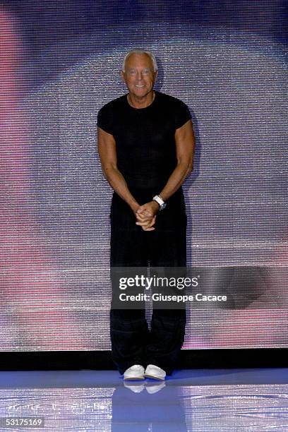 Italian designer Giorgio Armani acknowledges the applause at Giorgio Armani show as part of Milan Menswear Week Spring/Summer 2006 on June 30, 2005...
