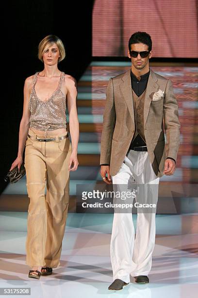 Models walk down the runway at Giorgio Armani show as part of Milan Menswear Week Spring/Summer 2006 on June 30, 2005 in Milan, Italy.
