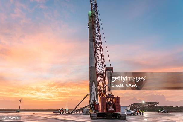 In this handout provided by the National Aeronautics and Space Administration , SpaceX's Falcon 9 first stage rocket is seen on December 22, 2015 in...