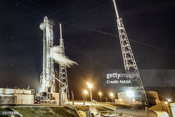 In this handout provided by the National Aeronautics and Space Administration , SpaceXs Falcon 9 rocket and Dragon spacecraft launch from Launch...