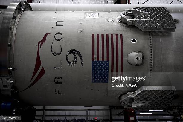 In this handout provided by the National Aeronautics and Space Administration , SpaceX's Falcon 9 first stage rocket waits in a hangar on December...