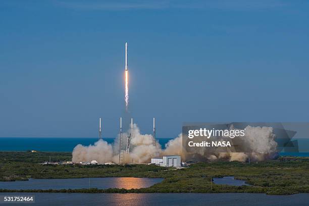 In this handout provided by the National Aeronautics and Space Administration , SpaceXs Falcon 9 rocket and Dragon spacecraft lift off from Launch...