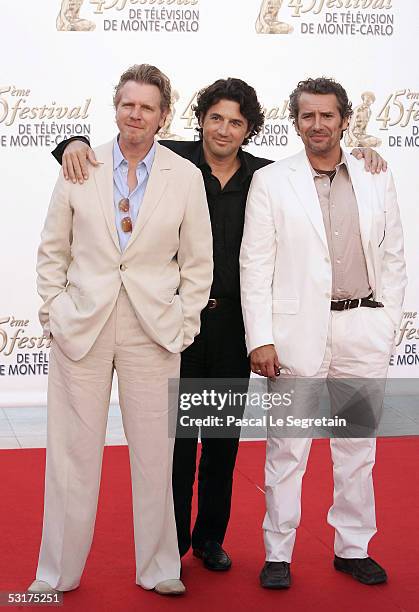 Actors Xavier Deluc Bruno Madinier Manuel Gelin pose as they arrive to attend the TF1 party at the Grimaldi Forum during the 45th Television Festival...