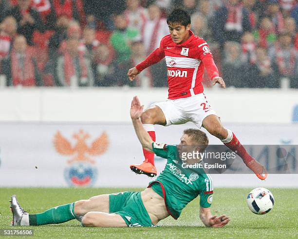 Lorenzo Melgarejo of FC Spartak Moscow is challenged by Andrei Semyonov of FC Terek Grozny during the Russian Premier League match between FC Spartak...