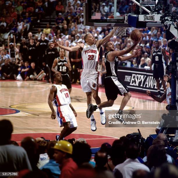 Tony Parker of the San Antonio Spurs goes for a layup against Tayshaun Prince of the Detroit Pistons in Game Five of the 2005 NBA Finals at the...