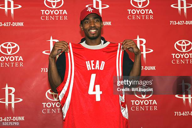 The Houston Rockets first round draft pick, Luther Head poses with his jersey during a press conference June 29, 2005 at the Toyota Center in...