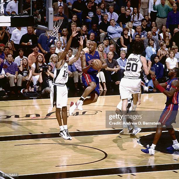 Chauncey Billups of the Detroit Pistons goes for a layup against Bruce Bowen and Manu Ginobili of the San Antonio Spurs in Game Six of the 2005 NBA...