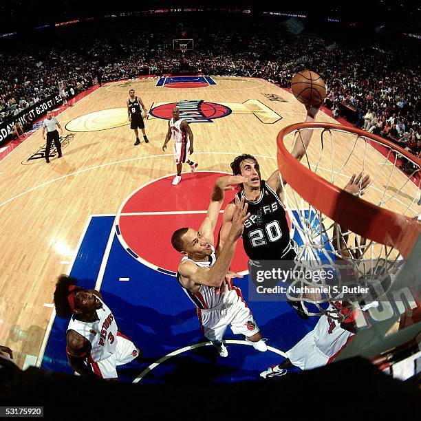 Manu Ginobili of the San Antonio Spurs goes for a layup against Tayshaun Prince of the Detroit Pistons in Game Five of the 2005 NBA Finals at the...
