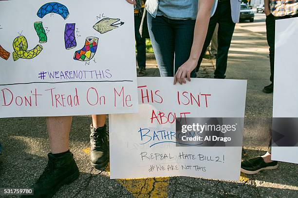 Protestors gather across the street from the North Carolina state legislative building as they voice their concerns over House Bill 2, in Raleigh,...