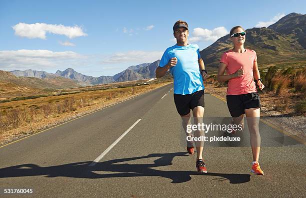 run while you can - road running stock pictures, royalty-free photos & images