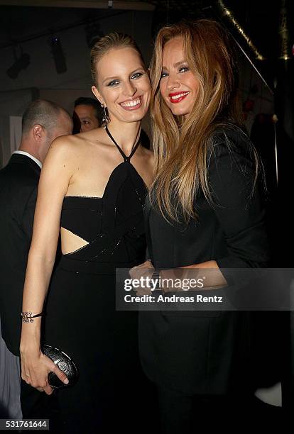 Karolina Kurkova and Adriana Karembeu attend The Harmonist Cocktail Party during The 69th Annual Cannes Film Festival at Plage du Grand Hyatt on May...