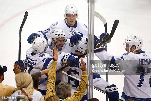 Anton Stralman of the Tampa Bay Lightning celebrates with his teammates after scoring a goal against Matt Murray of the Pittsburgh Penguins during...