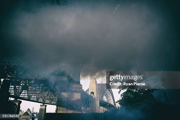 Artificial smoke is seen in front of the Sydney Harbour Bridge during the Manning Cartell show during Mercedes-Benz Fashion Week Australia at Milsons...