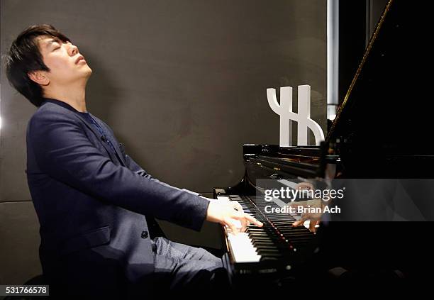 Pianist Lang Lang perfoms for an exclusive charity event at Hublot Fifth Avenue Boutique on May 16, 2016 in New York City.